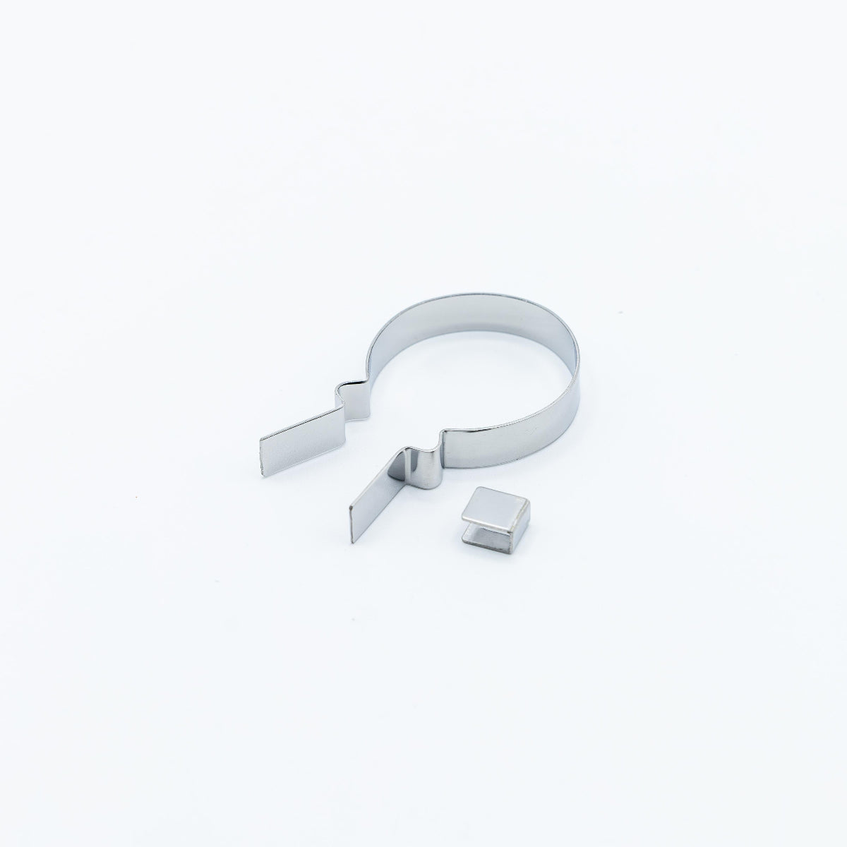 A small balloon metal lollipop mold photographed on a clean white background.