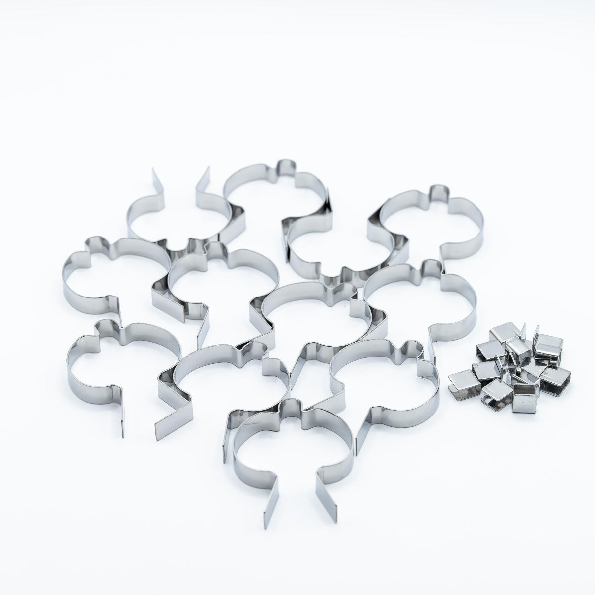 A set of stainless steel pumpkin shaped sucker molds photographed on a clean white background.