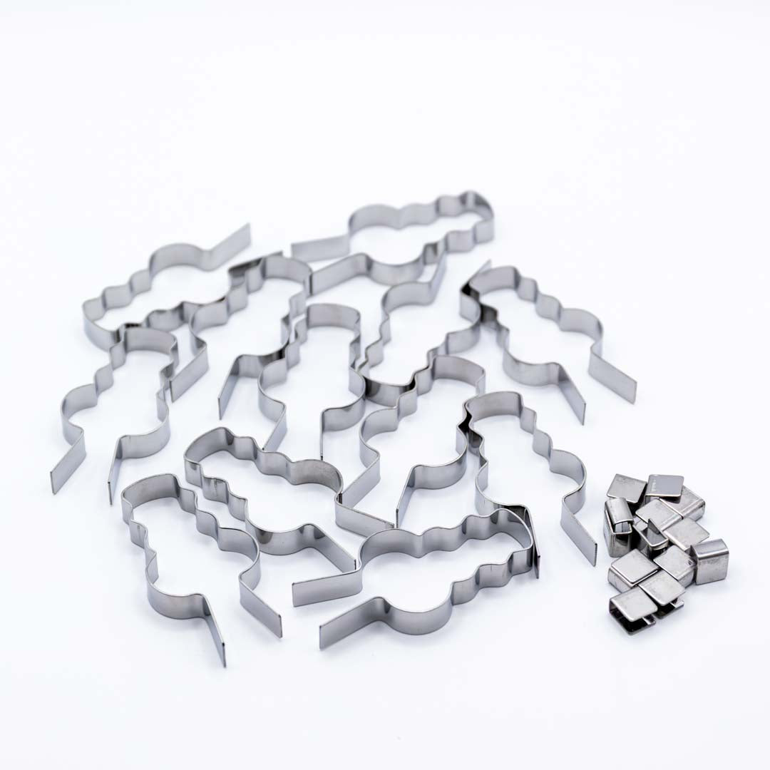 Set of metal snowman shaped lollipop molds on a white background